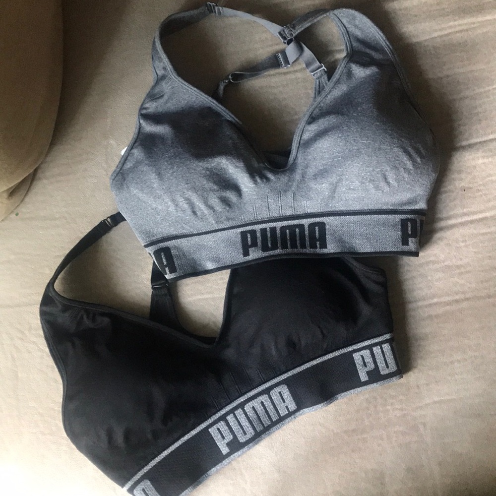 Two puma sports bras, black and gray